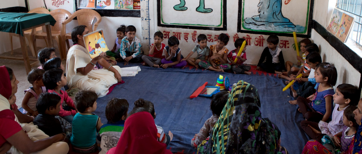 Bhopal, India: Children learn about nutrition at UNICEF feeding centre.